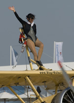 Wing-walker Peggy Krainz waving the crowd goodbye