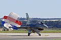 Royal Netherlands Air Force F-16 display aircraft J-008 from 313 Squadron returns after displaying trailing its brake parachute in national colours.