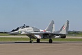 MiG-19UB Red 15 from the 1st. Tactical Squadron, Warszawa (Warsaw), of the Polish Air Force taxies in after displaying with cockpit periscope raised.