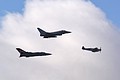 The Spitfire and Typhoon Synchro pair are joined by 111 Squadron flagship Tornado F.3 in a flypast to mark the formal parading of the 6 Squadron standard.