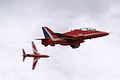 With his teammate in the background pulling away to land this Red Arrows Hawk continues ahead before breaking to maintain separation