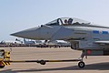 Best seat in the house for this 6 Squadron engineer as he waits for the 1 Squadron parade to end and his jet to be towed into place