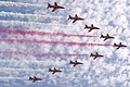 Flying  in 'Big Battle' formation the Royal Air Force Aerobatic Team The Red Arrows salute the 1 Squadron formation parade