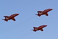 Performing in clear blue skies a three-ship section of BAe Hawks from the Red Arrows gets airborne.