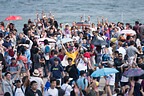 Crowd cheering on the formation teams as they displayed over the water