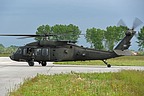 The UH-60M, serial #11-20413, is taxiing towards the take off point on the runway