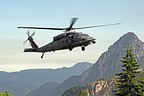 Approach to the narrow grassy strip. Flight engineer and gunner assist pilots in identifying any kind of obstacle during approach operation