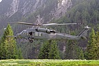 HH-60G Pave Hawk hovering over the narrow grassy strip