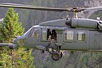 HH-60G Pave Hawk hovering over the narrow grassy strip