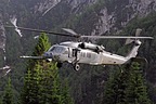 The 56th RQS HH-60G approaching to the grassy strip to simulate a personnel recovery with the hoist