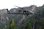 Flight engineer on board the HH-60G operating the hoist capable of lifting a 270 kilograms load (600 pound) from a hover height of 60.7 meters (200 feet)