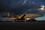 RSAF F-15C Eagle 215 in the evening sun with the thunderstorm clouds overhead