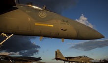 The Saudi F-15 line-up lit up by the last moments of sunlight