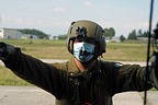 UH-205A crew chief wearing a protective medical mask as precaution due to the Covid-19 pandemic