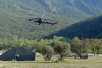 AH-129D Mangusta passing low by the mock-up of the damaged AH-129 on the ground