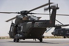 NH90 taxiing past a CH-47C Chinook of Task Force Fenice