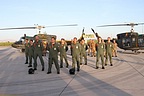 The 21° Gruppo flight and ground crews posing in front of their Tiger AB.212 helicopters.