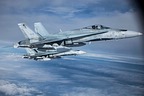 Royal Canadian Air Force CF-188 Hornets on the wing of the C-27J